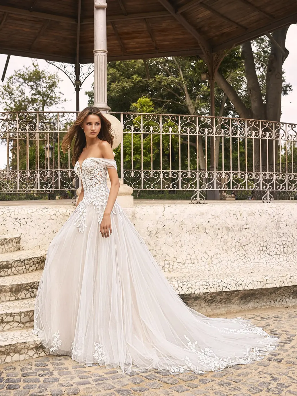 Romantic full-skirt wedding gown outdoors